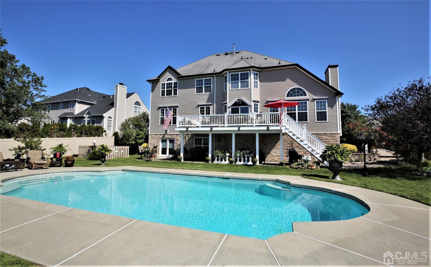 1 MacFarlane Circle Monroe Township, NJ 08831 - Photo 4 of 26 a view of a house with a yard and sitting area