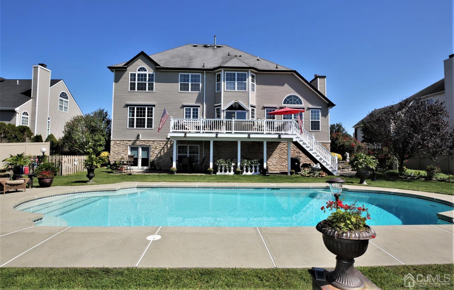 1 MacFarlane Circle Monroe Township, NJ 08831 - Photo 6 of 26 a front view of a house with a yard and potted plants