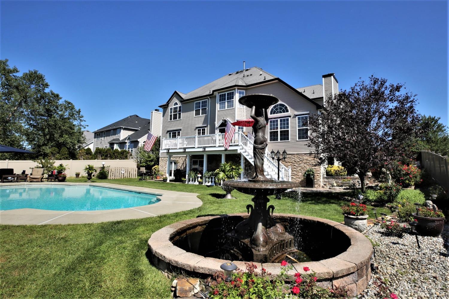 1 MacFarlane Circle Monroe Township, NJ 08831 - Photo 8 of 26 a front view of a house with swimming pool having outdoor seating