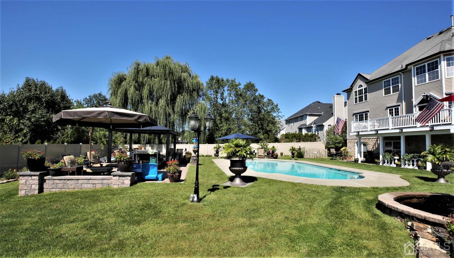 1 MacFarlane Circle Monroe Township, NJ 08831 - Photo 9 of 26 a view of outdoor space yard deck patio and fire pit