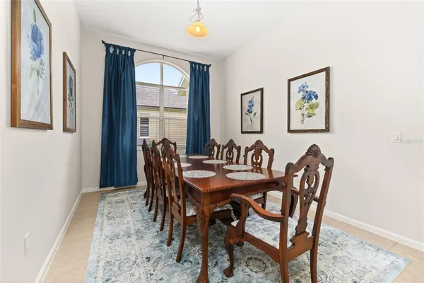 a view of a dining room with furniture and window