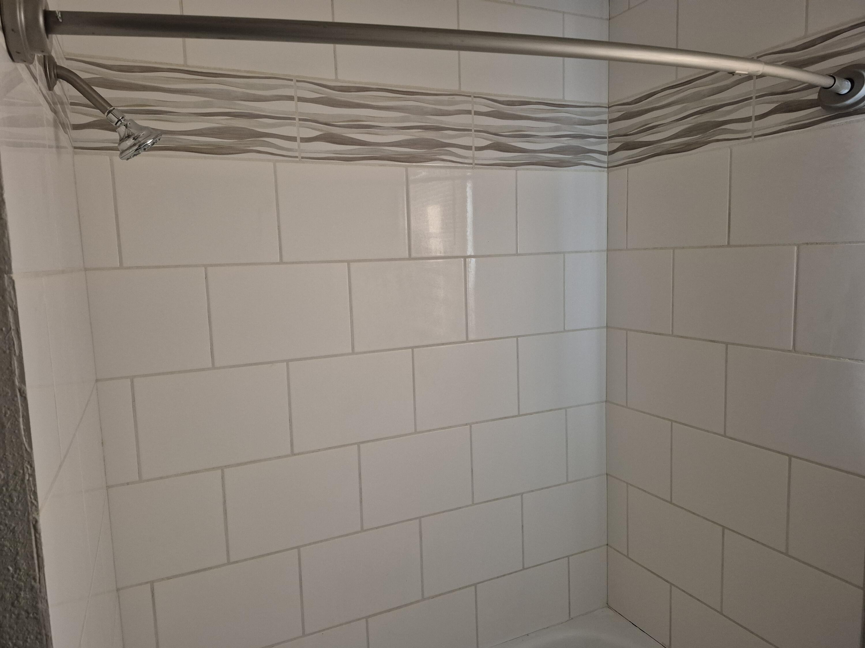 3517 30th Street Lubbock, TX 79410 - Photo 12 of 18 a bathroom with a shower