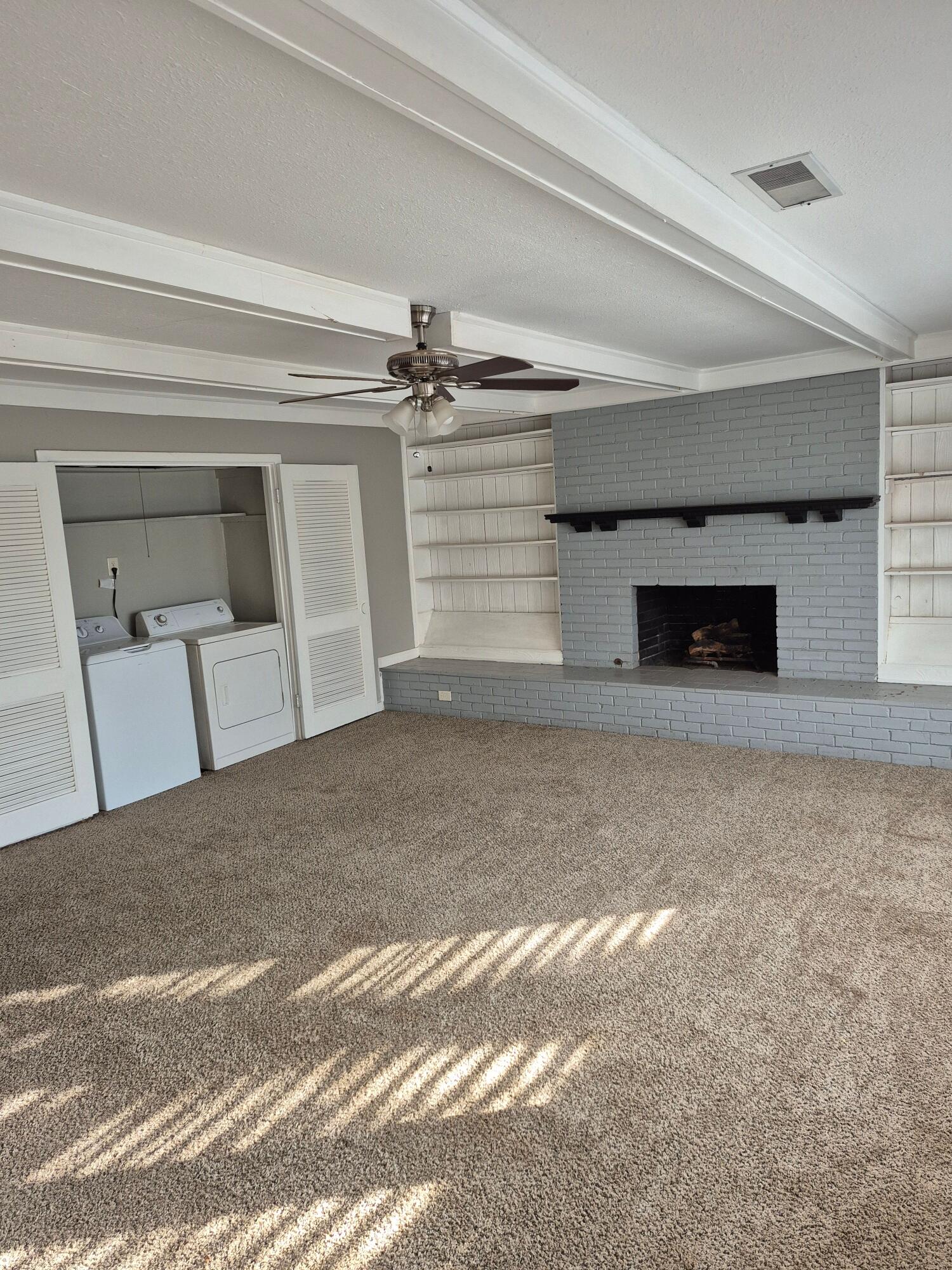 3517 30th Street Lubbock, TX 79410 - Photo 7 of 18 a view of a livingroom with a staircase