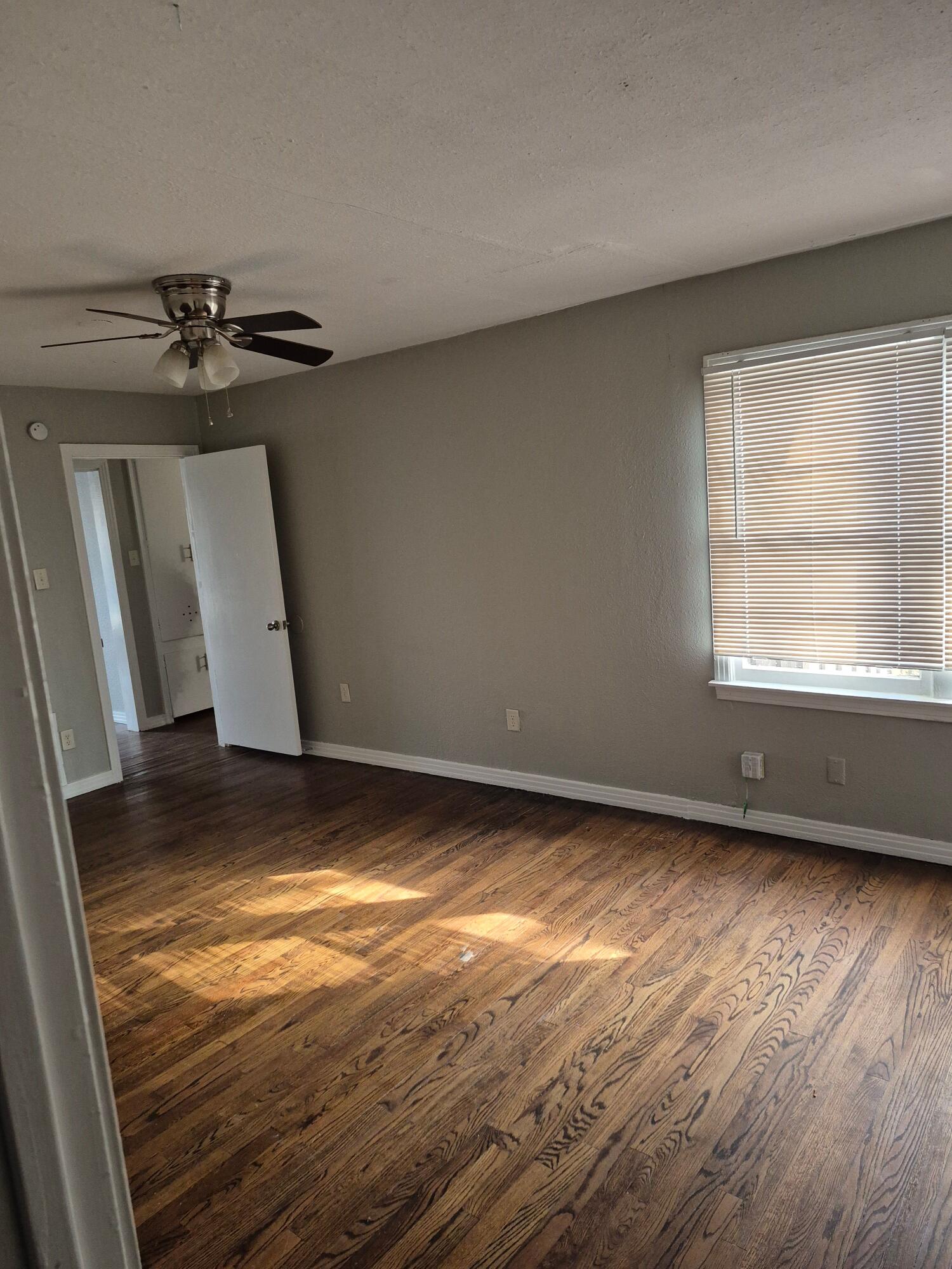 3517 30th Street Lubbock, TX 79410 - Photo 9 of 18 a view of an empty room with a window