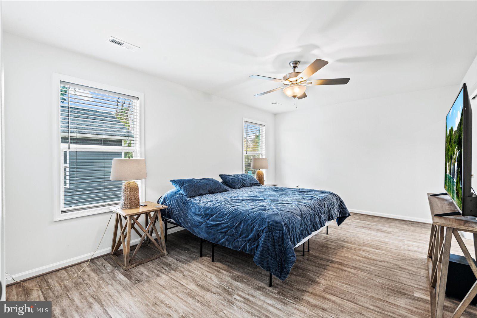 121 1st Street Colonial Beach, VA 22443 - Photo 20 of 46 a bedroom with a bed and a flat screen tv