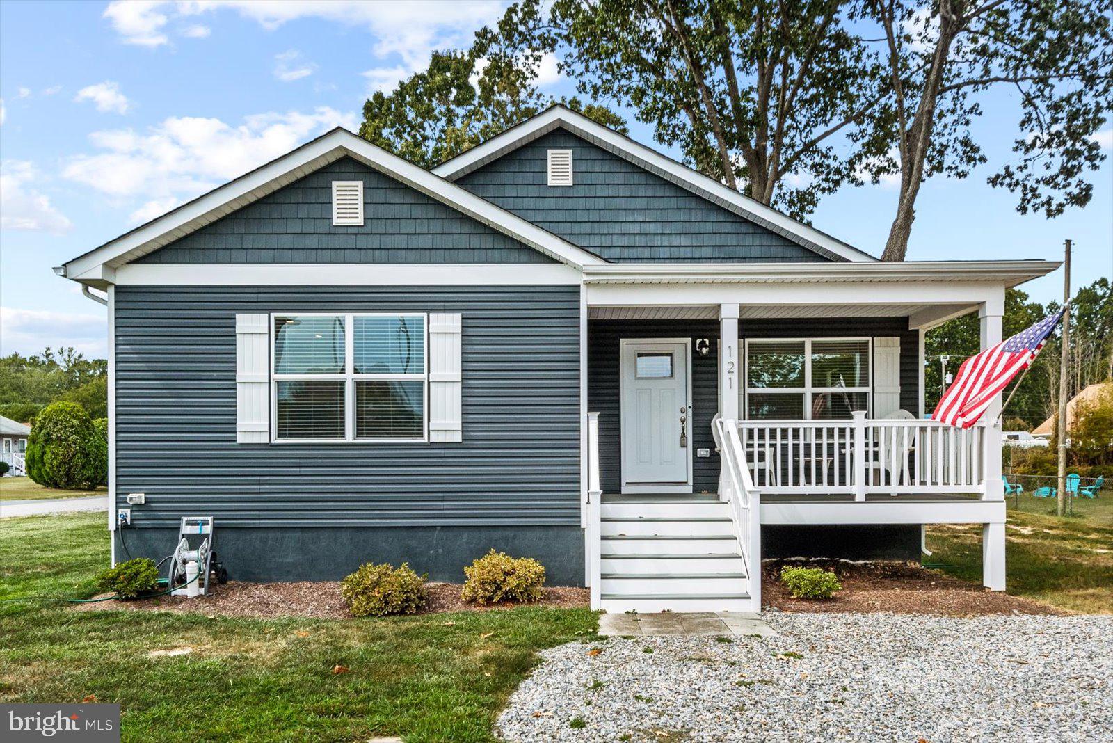 121 1st Street Colonial Beach, VA 22443 - Photo 2 of 46 a front view of a house with a yard
