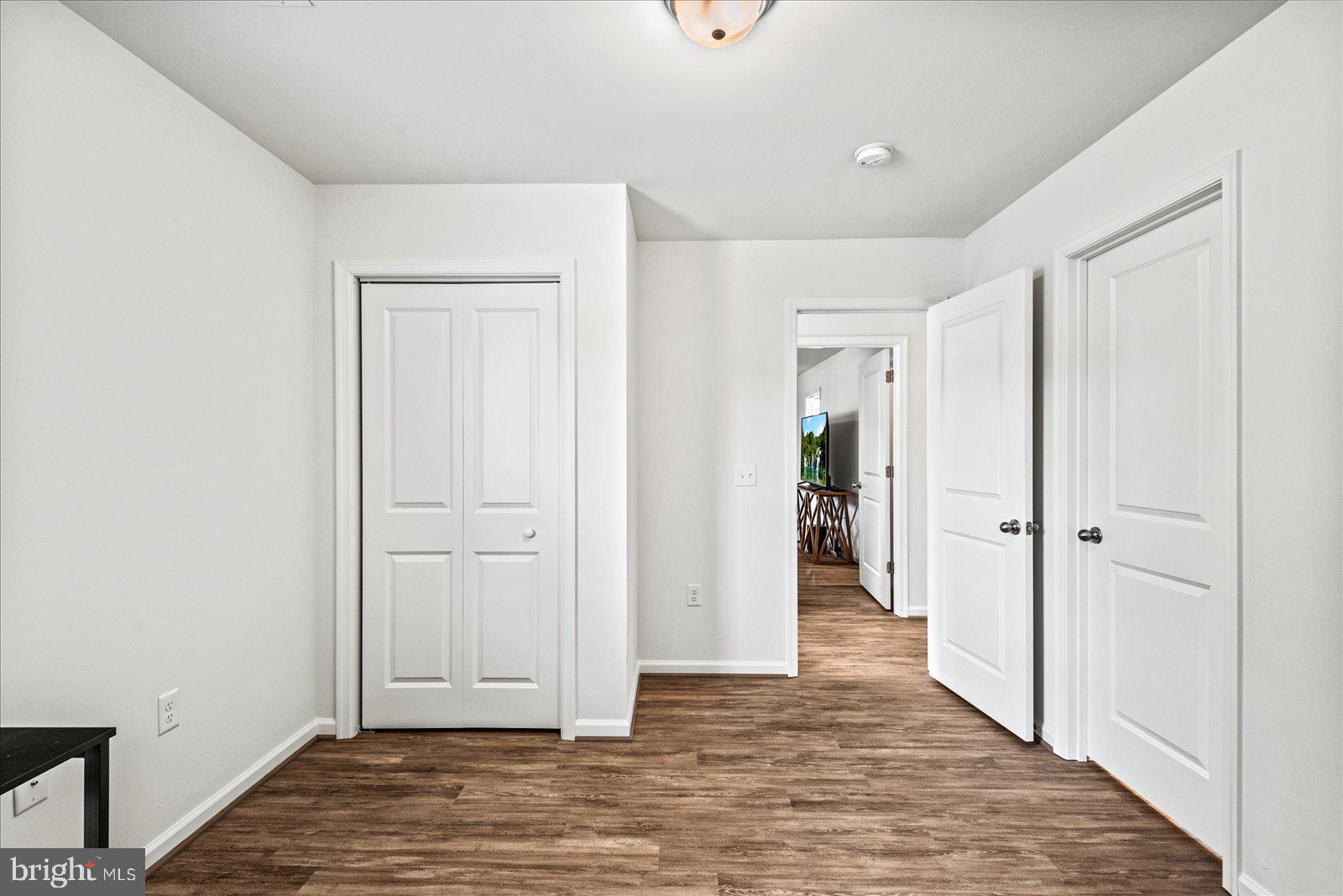 121 1st Street Colonial Beach, VA 22443 - Photo 23 of 46 wooden floor & closet area in a room
