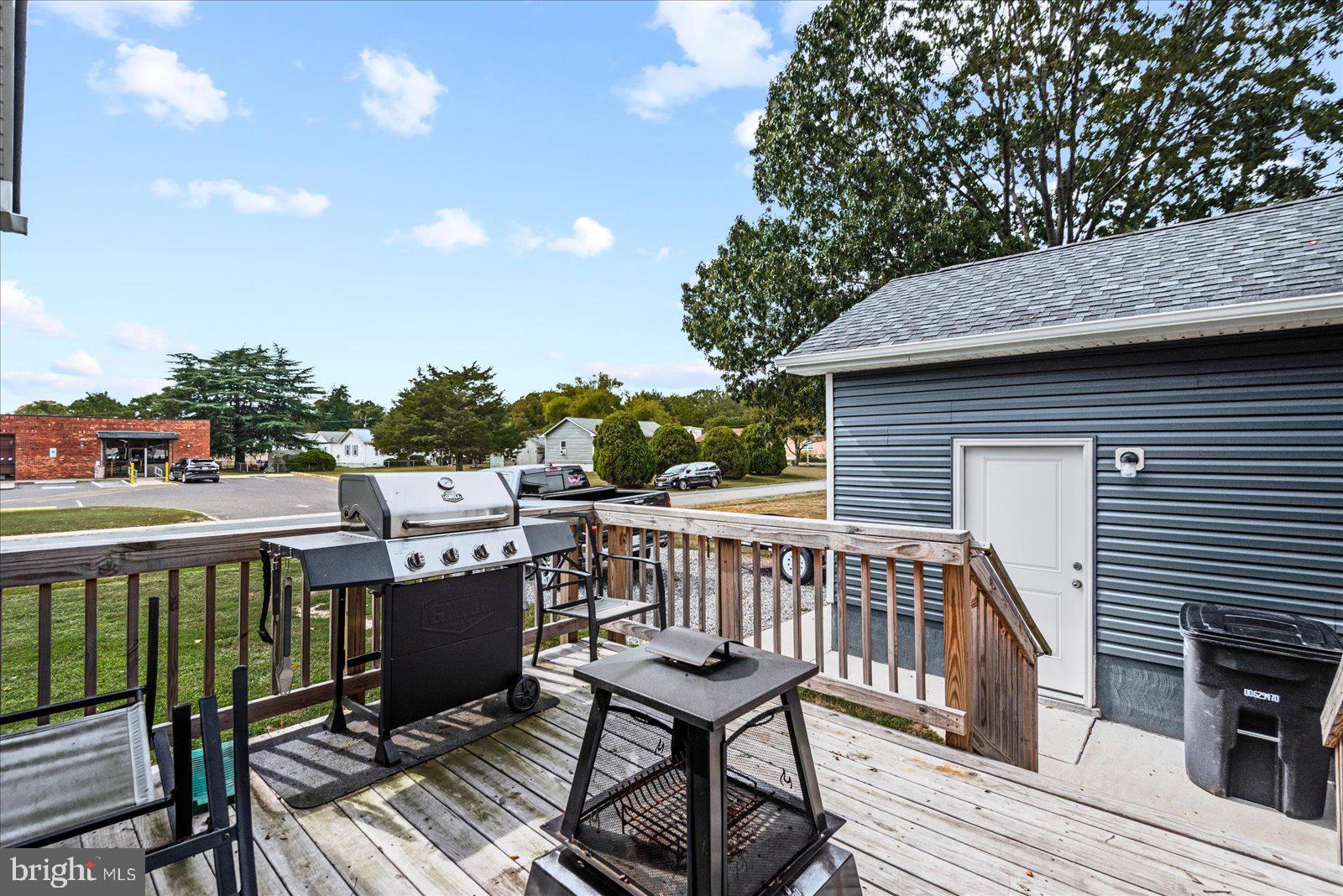 121 1st Street Colonial Beach, VA 22443 - Photo 32 of 46 a view of a roof deck with wooden floor and fence