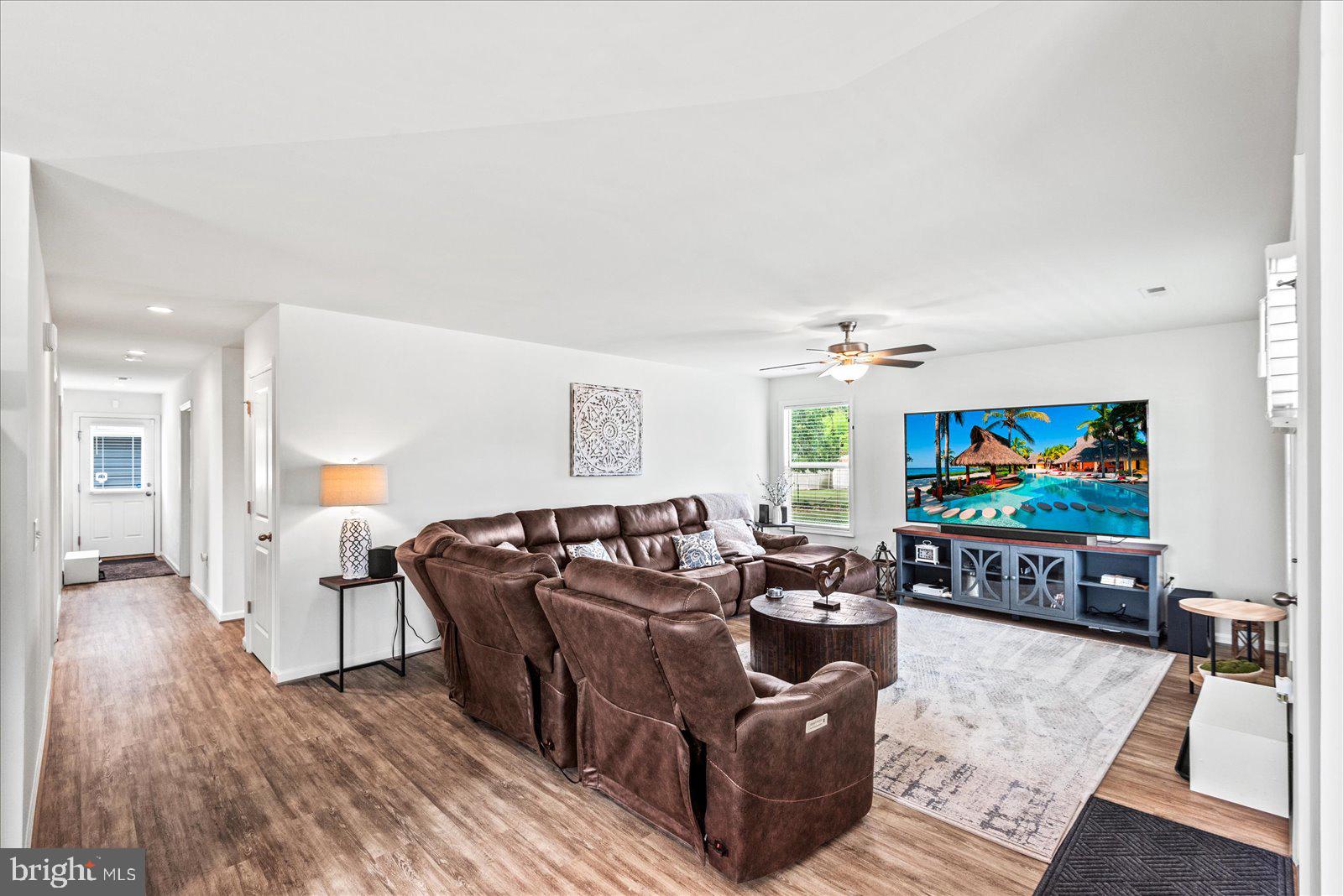 121 1st Street Colonial Beach, VA 22443 - Photo 6 of 46 a living room with furniture and a flat screen tv