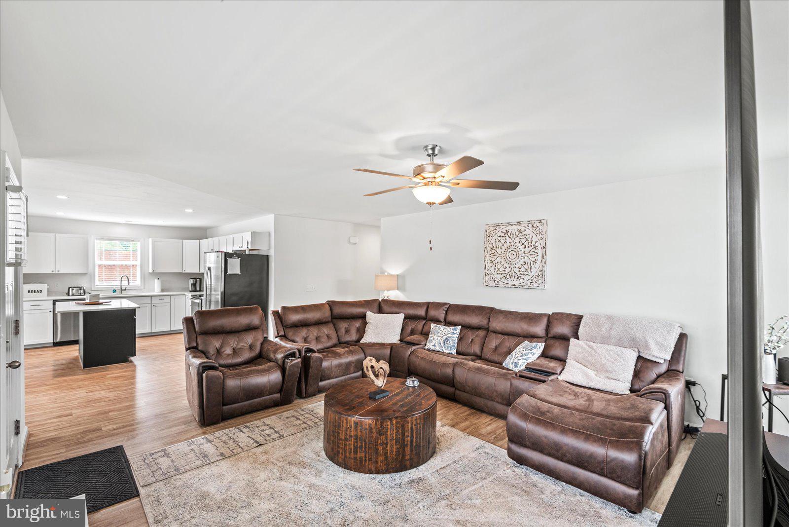 121 1st Street Colonial Beach, VA 22443 - Photo 8 of 46 a living room with furniture and a wooden floor