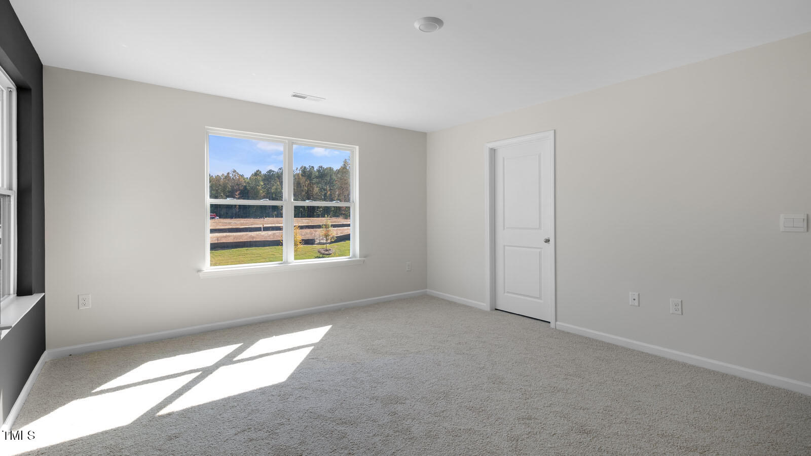793 Old Tarboro Road Wendell, NC 27591 - Photo 11 of 32 an empty room with windows