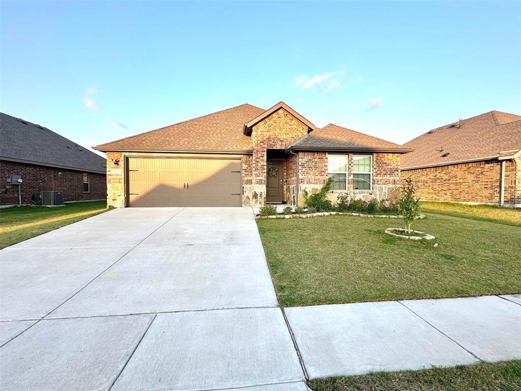324 Revolution Road Fate, TX 75189 - Photo 1 of 15 Brick and stone façade with an attached garage