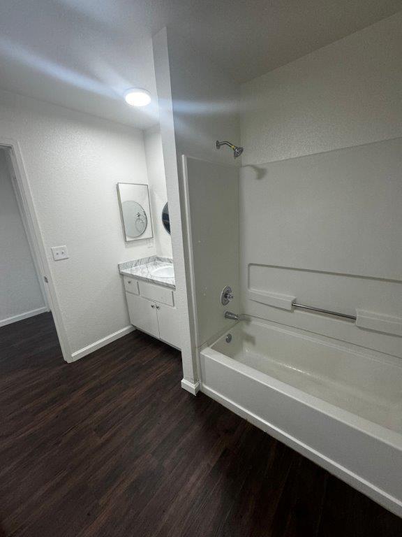 1405 East Cypress Avenue Reedley, CA 93654 - Photo 21 of 29 a bathroom with a bathtub and a sink