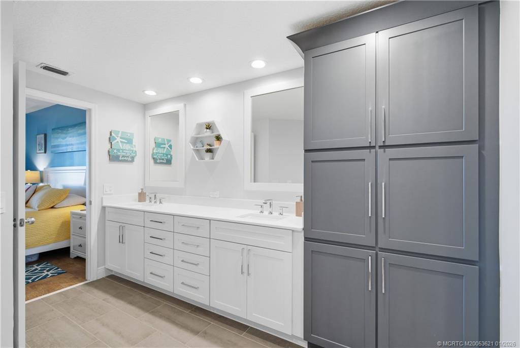 391 Northeast Plantation Road, Unit 215 Stuart, FL 34996 - Photo 19 of 40 Primary bath - extra storage