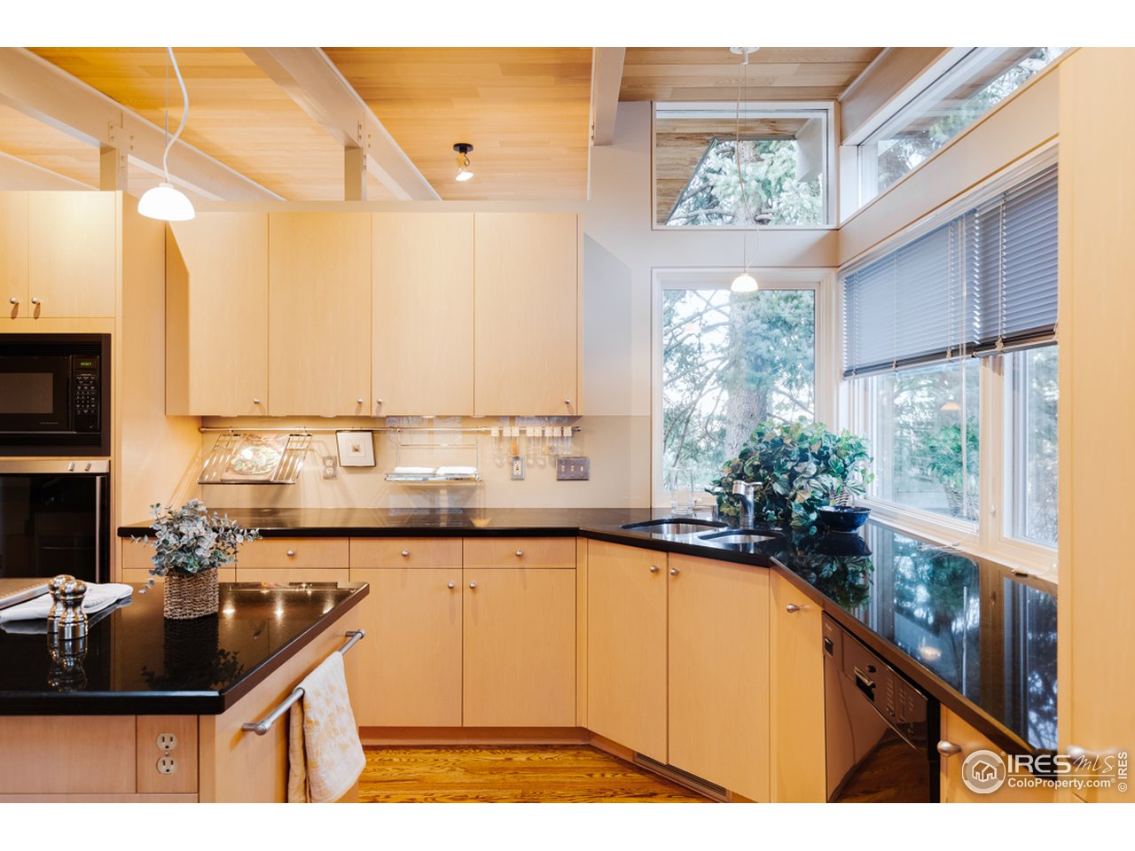 985 7th Street Boulder, CO 80302 - Photo 11 of 39 a kitchen with a sink stove and cabinets