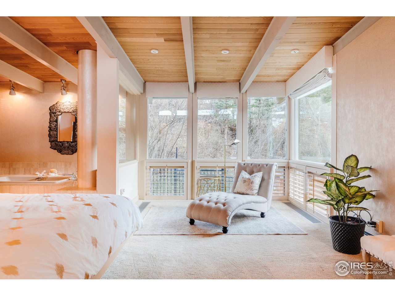 985 7th Street Boulder, CO 80302 - Photo 20 of 39 a bedroom with a bed and large windows