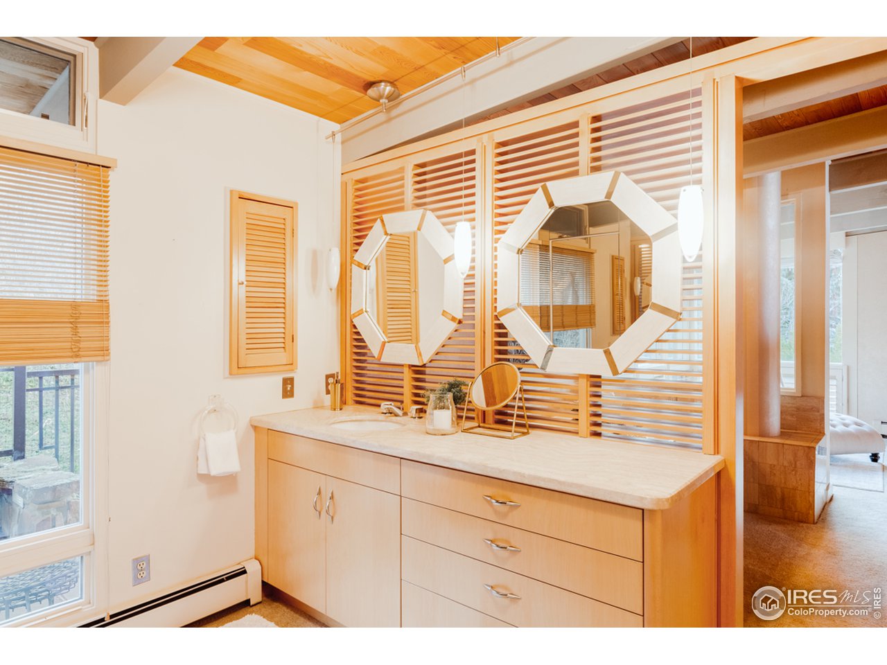 985 7th Street Boulder, CO 80302 - Photo 22 of 39 a bathroom with a sink and a mirror