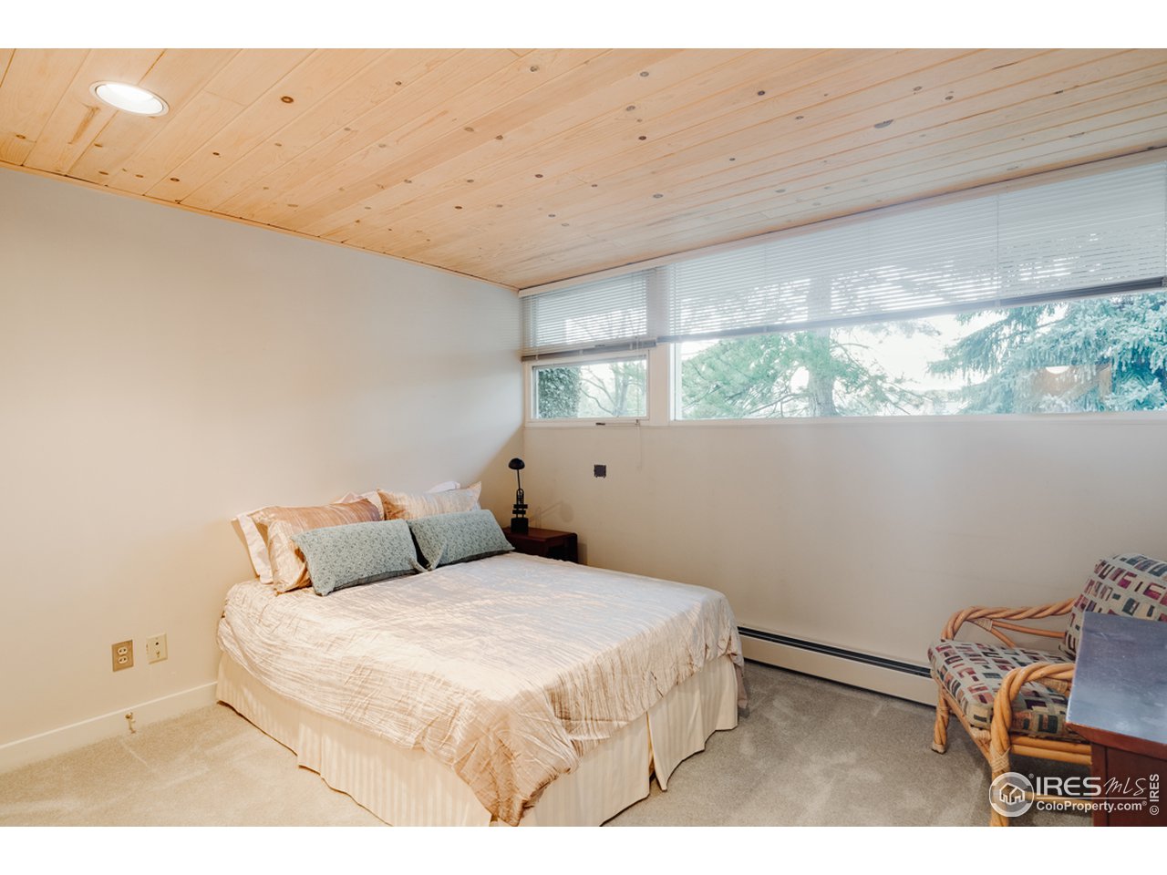 985 7th Street Boulder, CO 80302 - Photo 26 of 39 a bedroom with a bed and a window