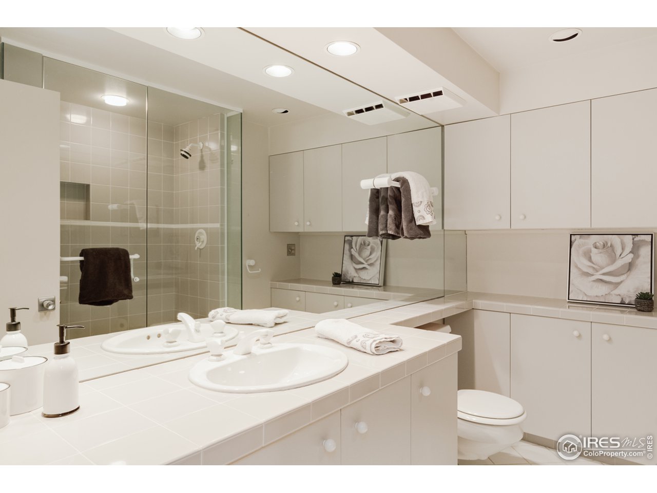 985 7th Street Boulder, CO 80302 - Photo 28 of 39 a bathroom with a sink a toilet and mirror