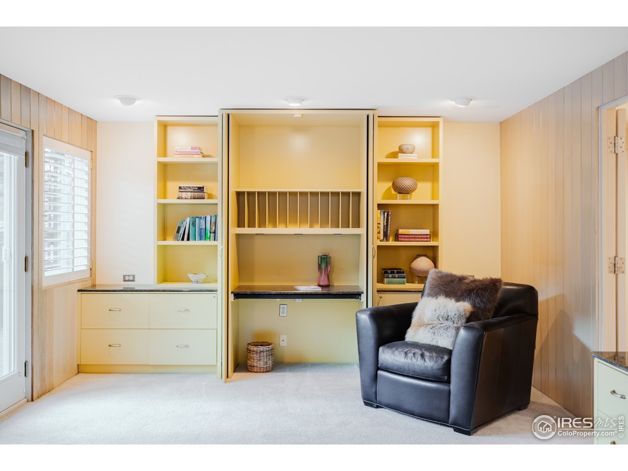 985 7th Street Boulder, CO 80302 - Photo 29 of 39 a living room with furniture and a window