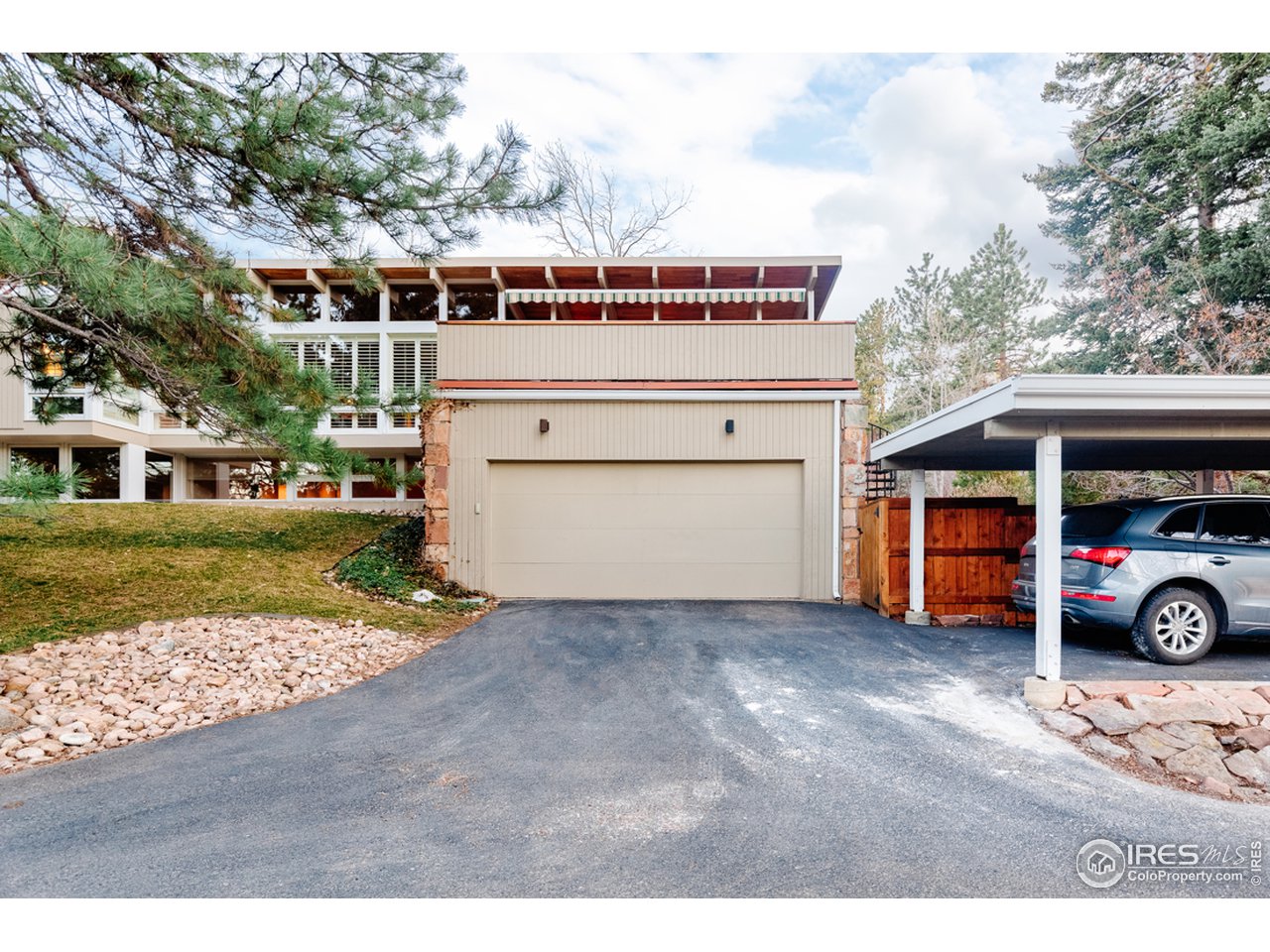 985 7th Street Boulder, CO 80302 - Photo 37 of 39 a view of a blue swimming pool and a yard