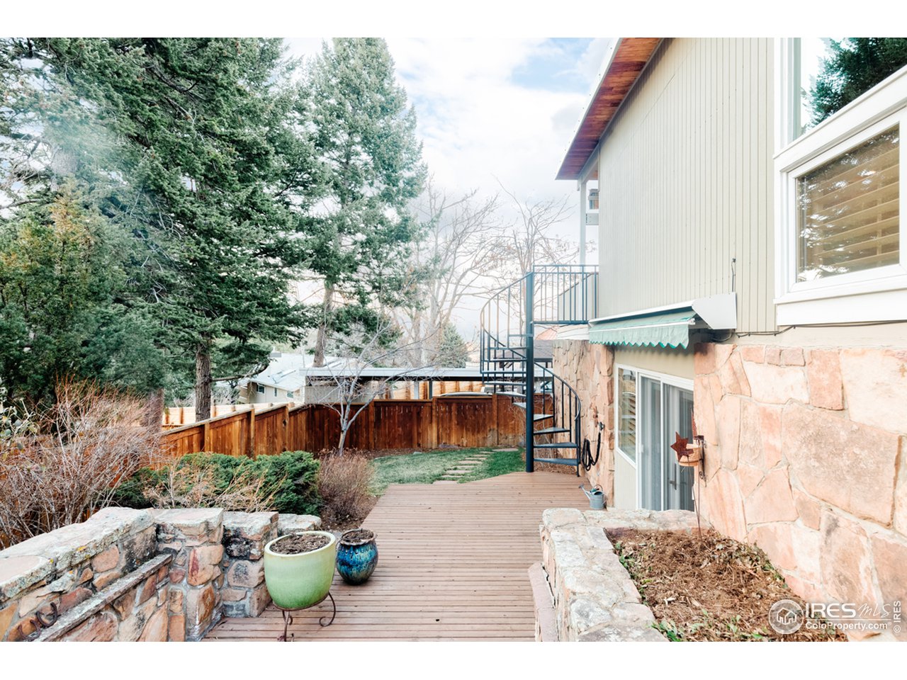 985 7th Street Boulder, CO 80302 - Photo 38 of 39 a view of a back yard of the house and a car parked