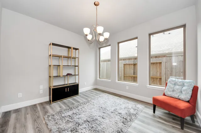 a view of livingroom with furniture cabinet and wooden floor