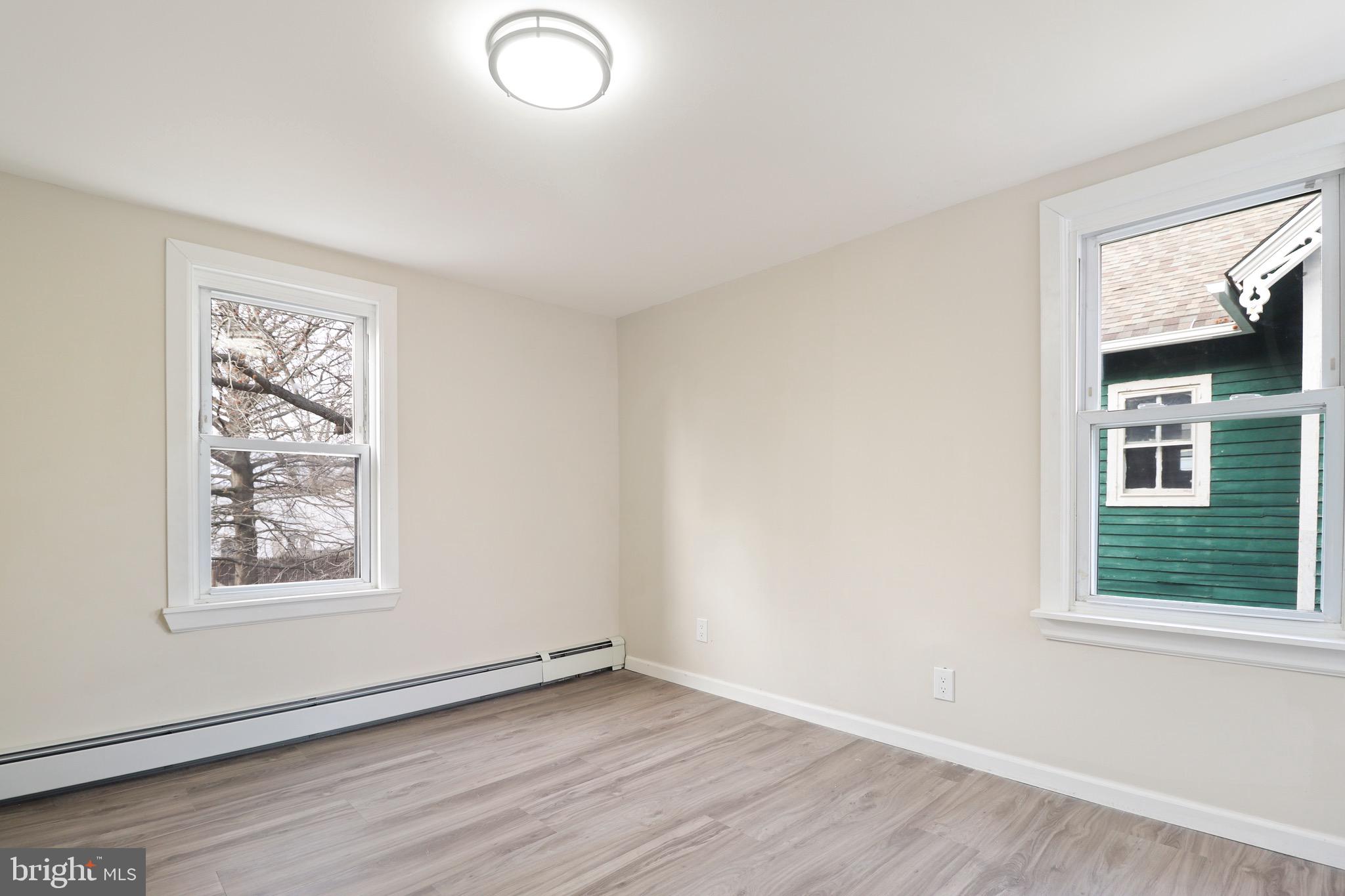 155 7th Street Salem, NJ 08079 - Photo 14 of 20 an empty room with windows