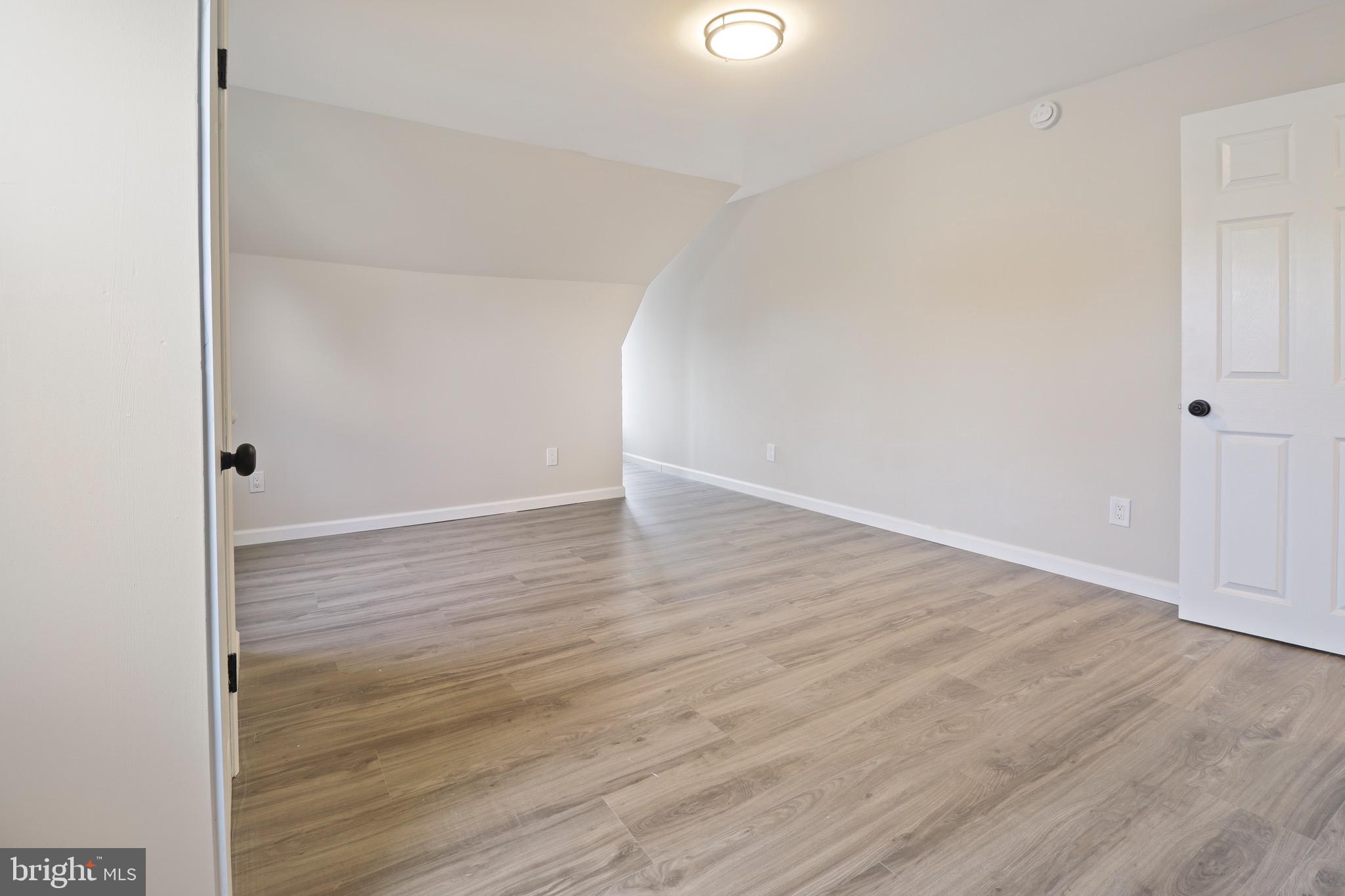 155 7th Street Salem, NJ 08079 - Photo 18 of 20 a view of an empty room with wooden floor