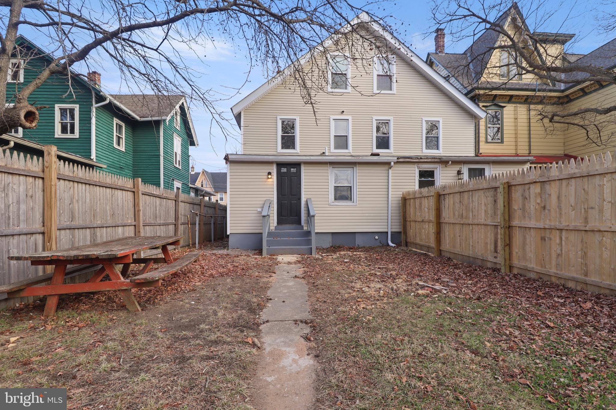 155 7th Street Salem, NJ 08079 - Photo 20 of 20 a view of a white house with a table and chairs