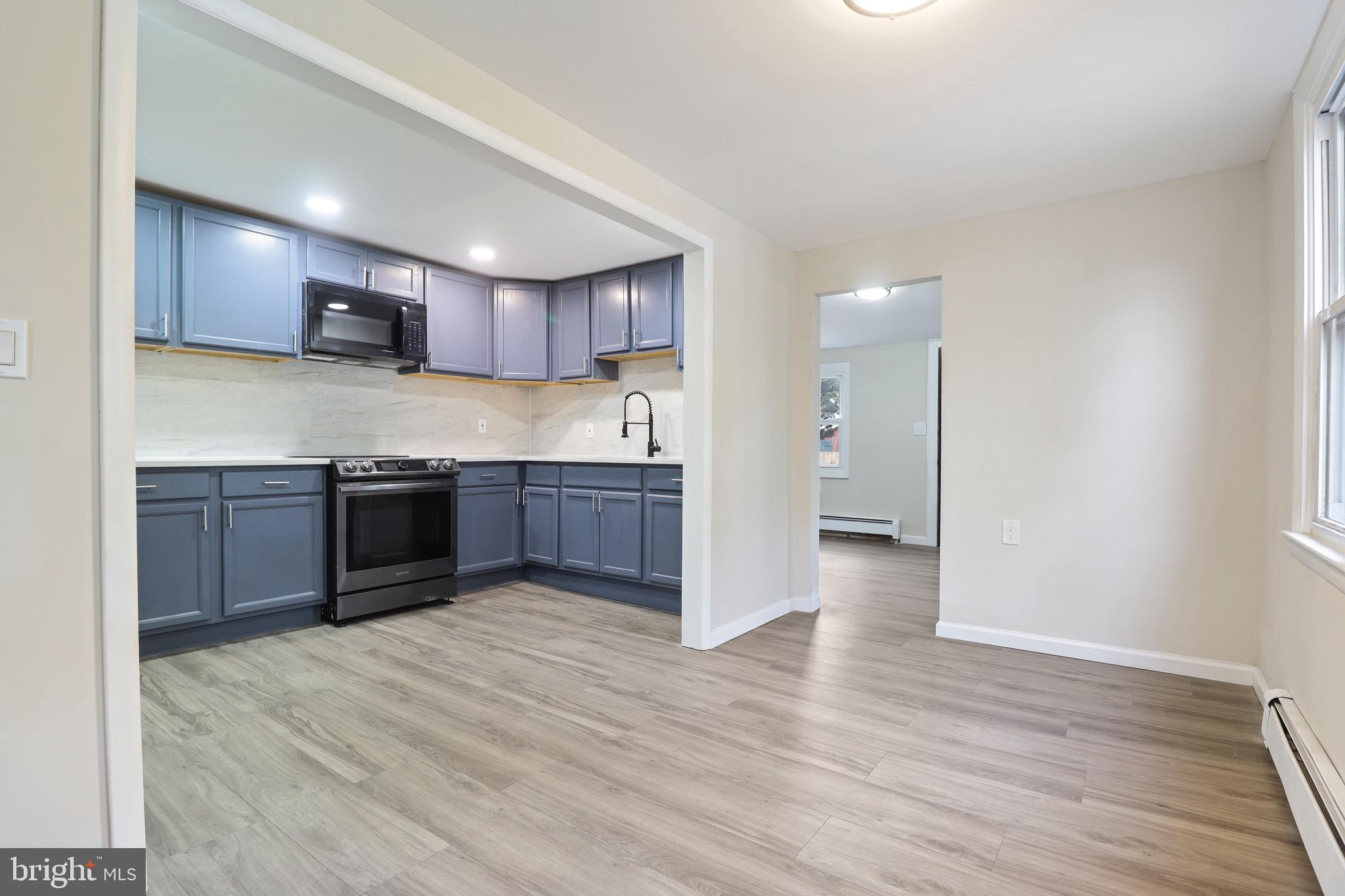 155 7th Street Salem, NJ 08079 - Photo 5 of 20 a view of kitchen with wooden floor