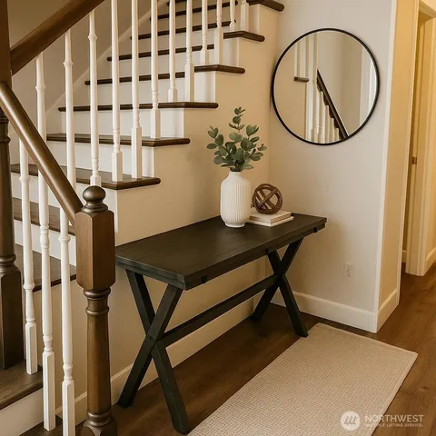 a view of a livingroom with furniture and entryway