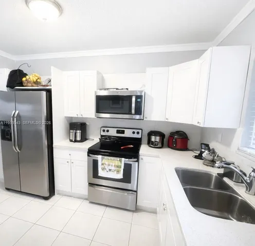 $335,000 | 13715 Kendale Lakes Circle, Unit A116, Miami, FL 33183