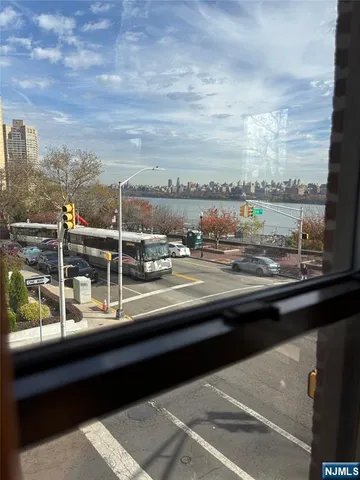 a view of a balcony next to a yard