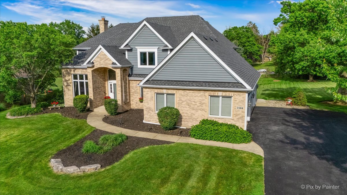 7104 Dove Way Cary, IL 60013 - Photo 71 of 82 a front view of a house with a yard