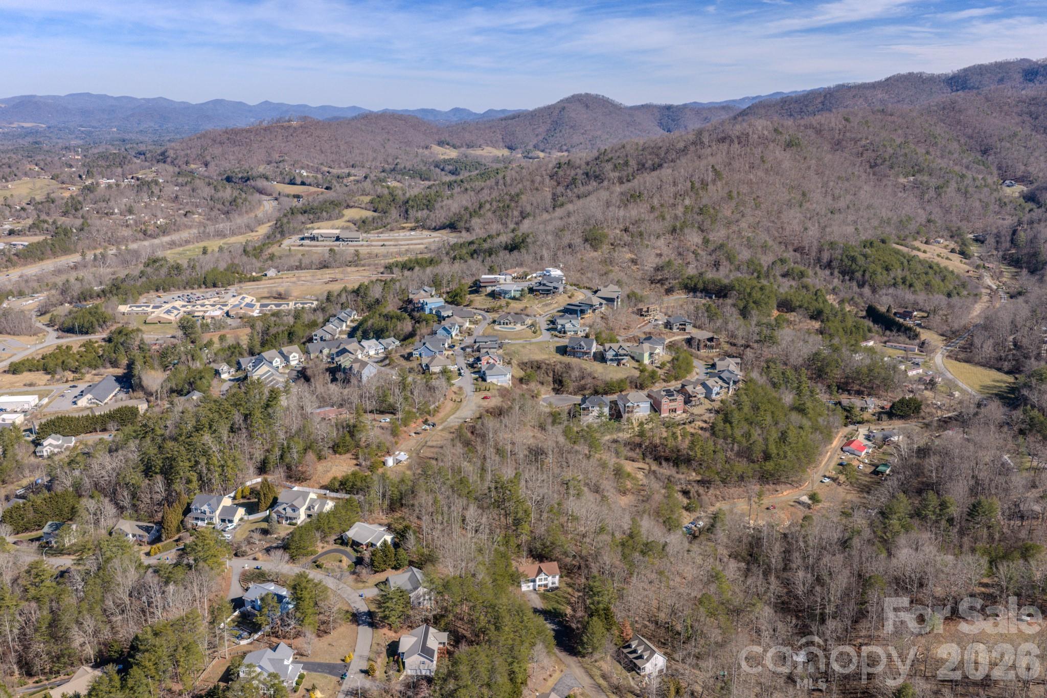 99999 Ralph Lunsford Road, Unit LOT 2 Weaverville, NC 28787 - Photo 5 of 13 a view of a town with mountains in the background