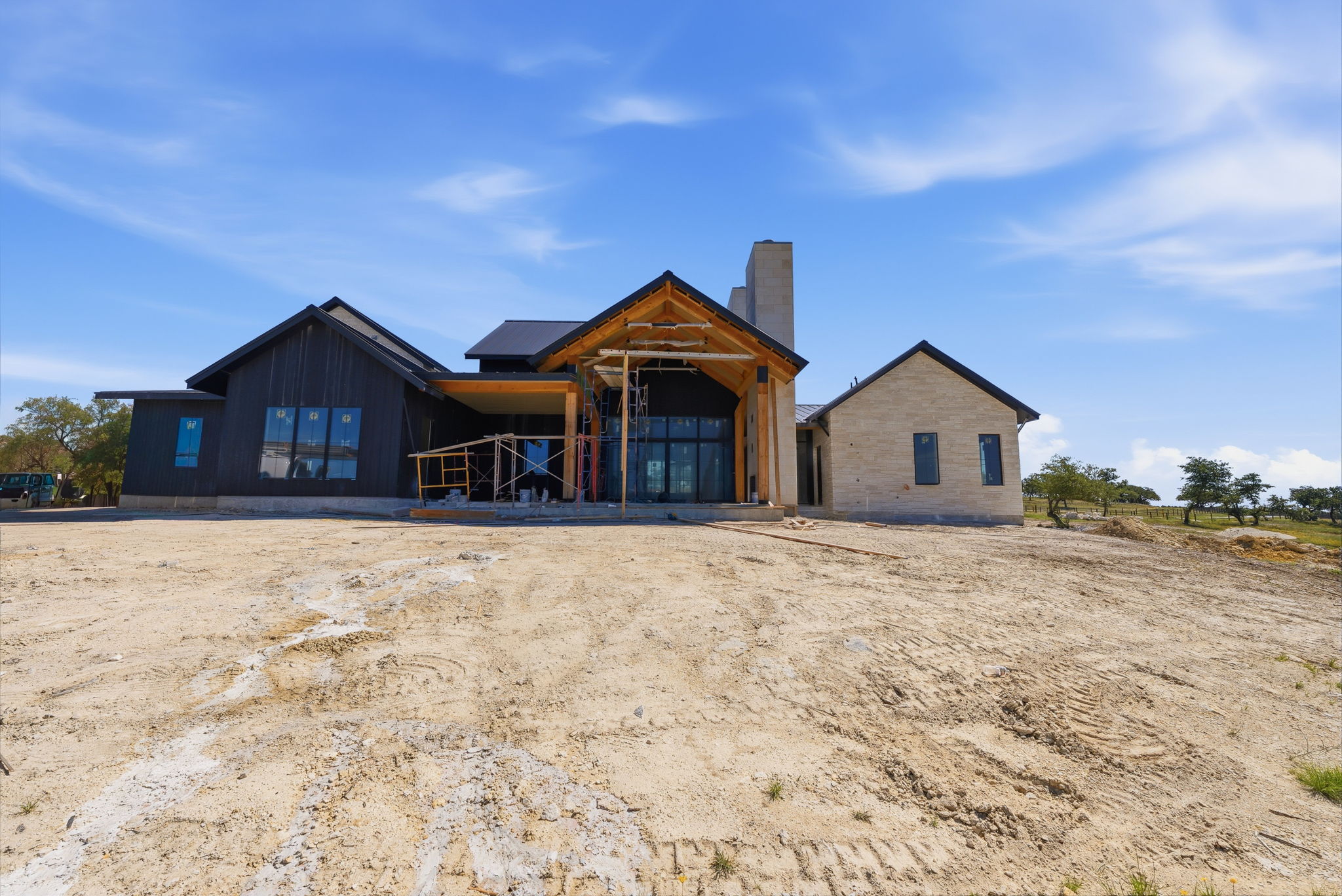 3300 Rm-165 Dripping Springs Dripping Springs, TX 78620 - Photo 8 of 25 a front view of a house with a yard