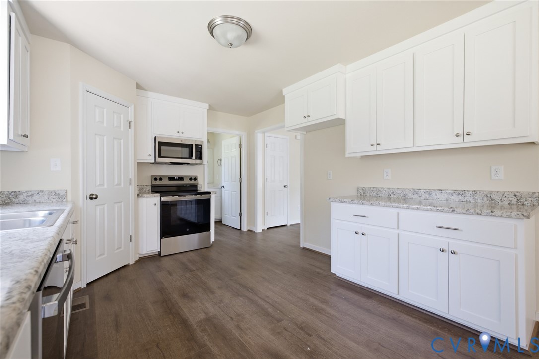 8440 Railroad Bed Road Carson, VA 23830 - Photo 35 of 39 Kitchen featuring white cabinetry, stainless steel