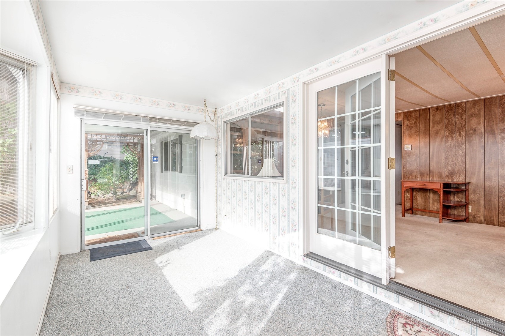 201 Union Avenue Southeast, Unit 99 Renton, WA 98059 - Photo 13 of 30 a view of a big room with wooden floor and windows