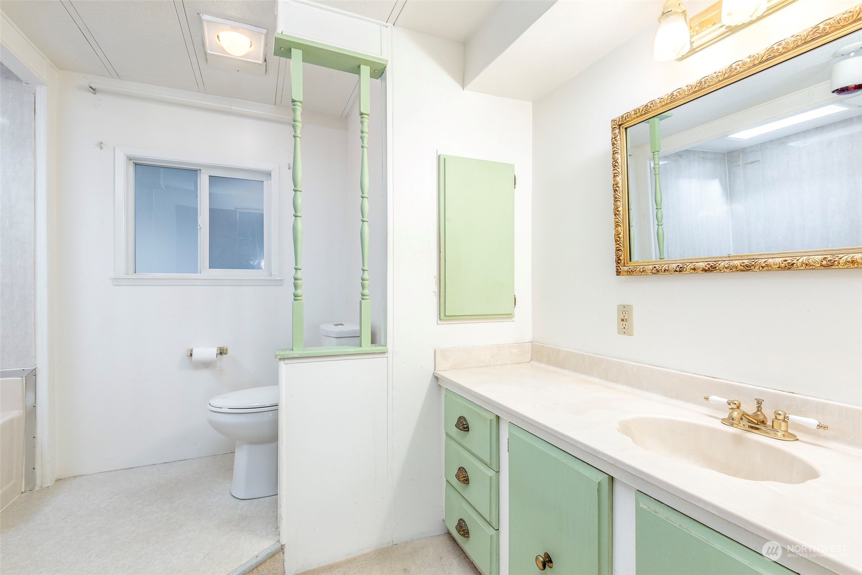 201 Union Avenue Southeast, Unit 99 Renton, WA 98059 - Photo 17 of 30 a bathroom with a sink a toilet and a mirror