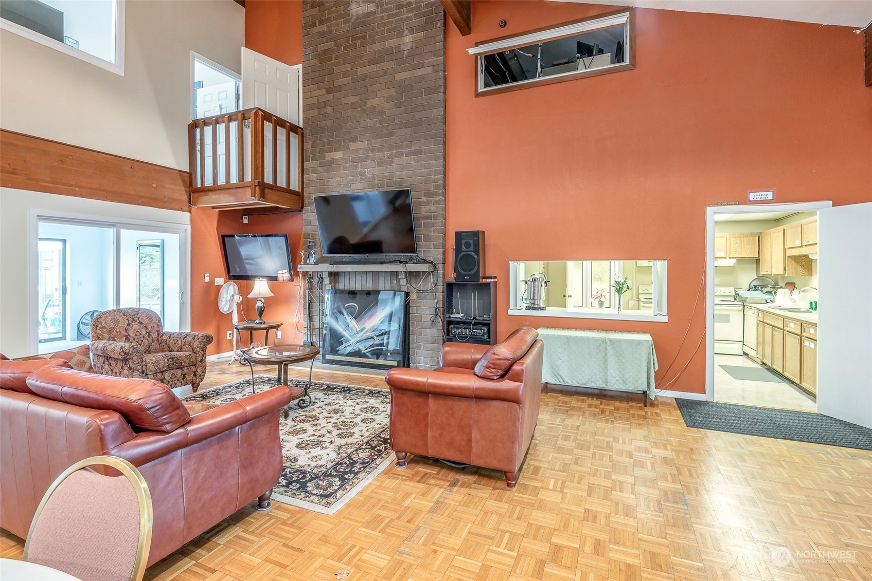 201 Union Avenue Southeast, Unit 99 Renton, WA 98059 - Photo 25 of 30 a living room with furniture a fireplace and a flat screen tv