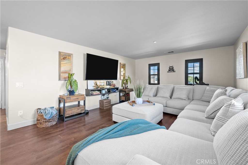 7925 Hemingway Court Fontana, CA 92336 - Photo 11 of 30 a living room with furniture and a flat screen tv