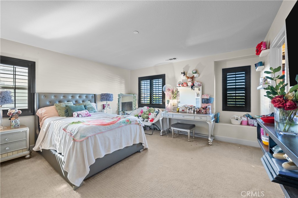 7925 Hemingway Court Fontana, CA 92336 - Photo 16 of 30 a bedroom with bed and a couch