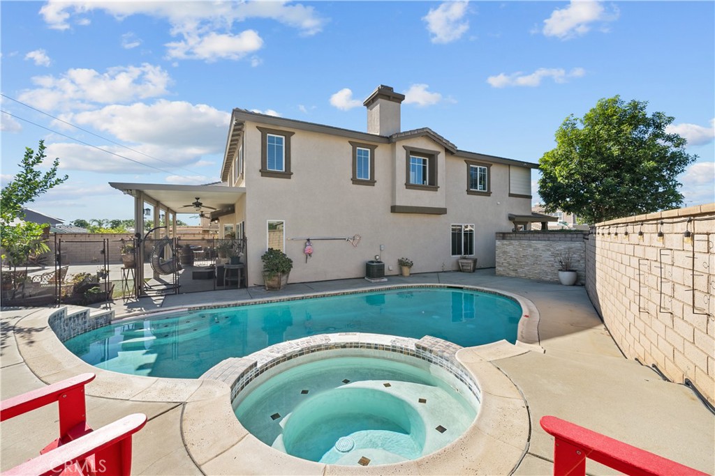 7925 Hemingway Court Fontana, CA 92336 - Photo 2 of 30 a swimming pool with outdoor seating and barbeque