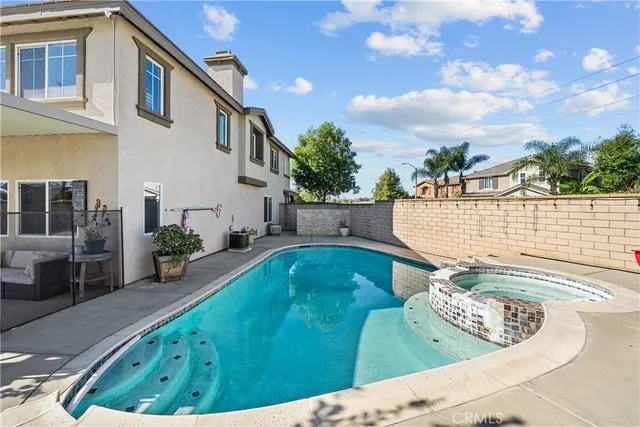 a view of a swimming pool with a patio