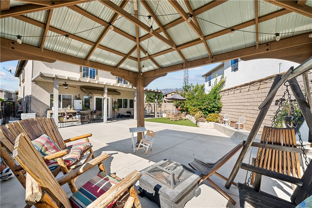 7925 Hemingway Court Fontana, CA 92336 - Photo 27 of 30 a view of a patio with a table and chairs