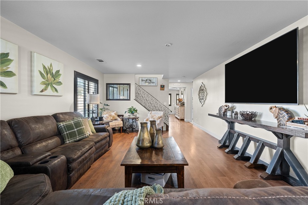 7925 Hemingway Court Fontana, CA 92336 - Photo 4 of 30 a living room with furniture and a flat screen tv