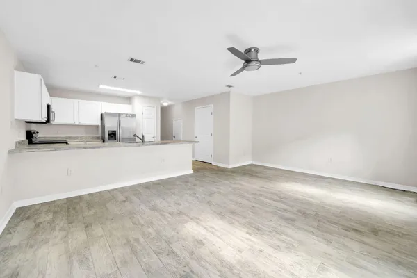 a view of a kitchen with a sink and a window