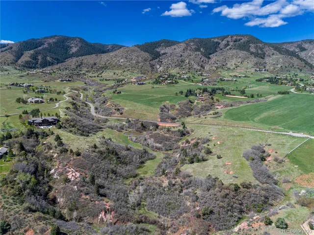 a view of a city with mountains in the background