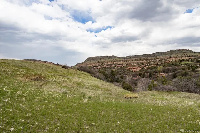 a view of a city with mountains in the background